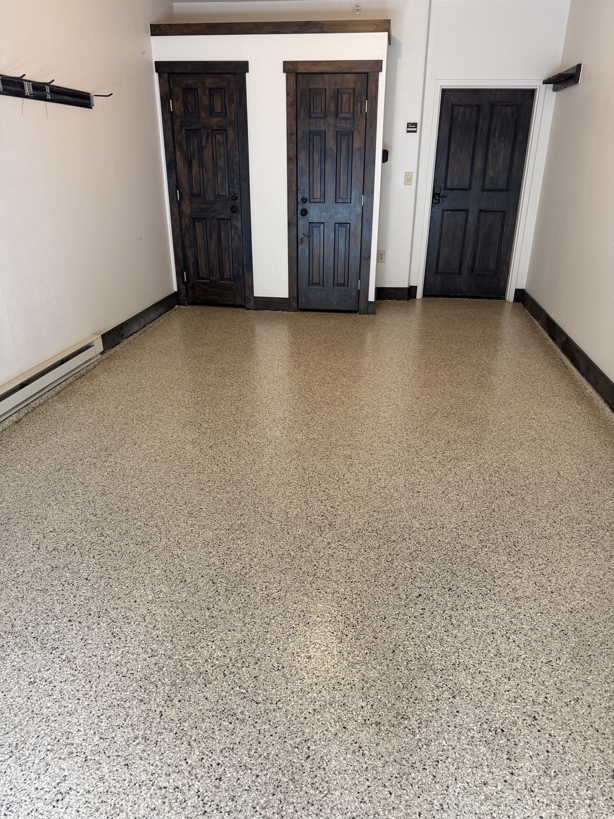 After — tan epoxy flake garage floor in a Keystone CO mountain home garage