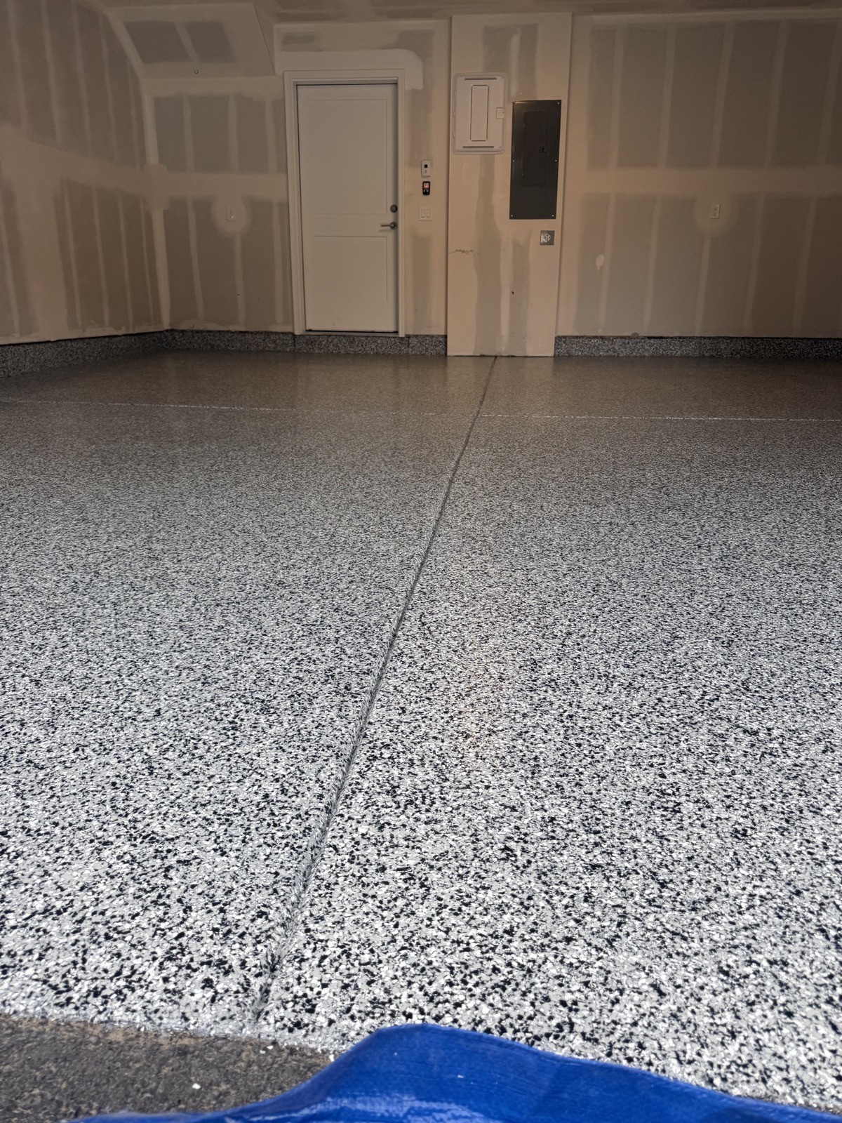 After — grey epoxy flake garage floor in a Silverthorne CO mountain home garage