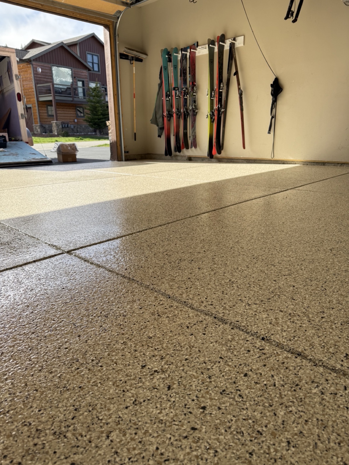 After — tan epoxy flake garage floor in a Silverthorne CO mountain home ski garage